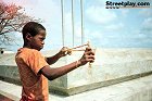 Haitian boy with slingshot