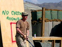 Soldier playing stickball
