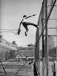 Kid jumping from swing