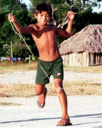 Boy playing with traditional top in northern Brazil