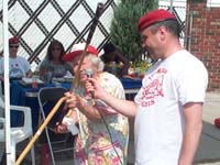 Aunt Mary Stacey examines the bat.