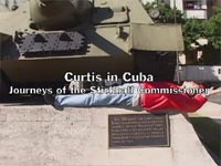 Curtis lies before Russian tank