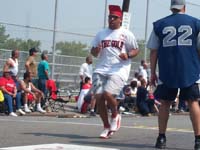 Raul Morales coming to the plate on his solo home run in finals match