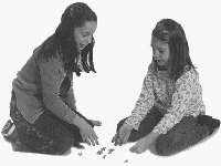 Girls playing jacks